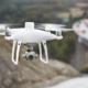 DJI Phantom 4 RTK Drone flying over bridge