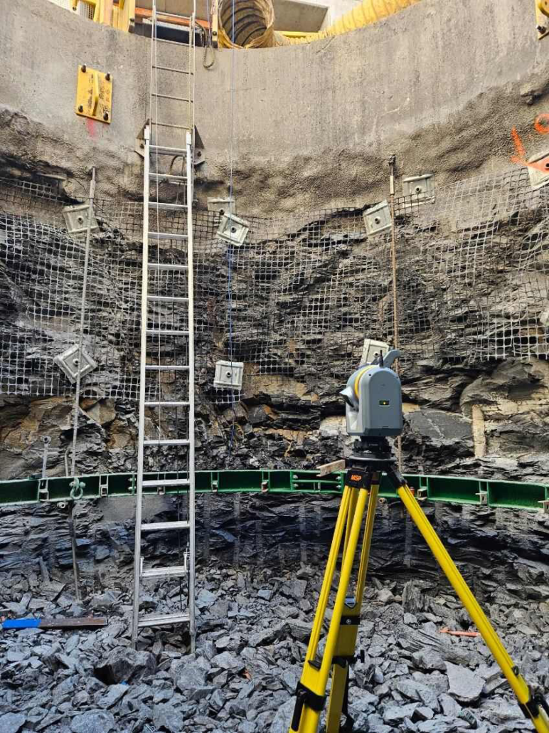 Surveyor using Trimble SX12 in a vertical mineshaft.