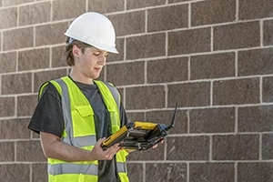 Trimble T110 tablet with lady in hand
