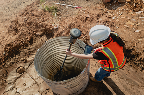 Trimble ST30 in a cylinder on a jobsite with a lady